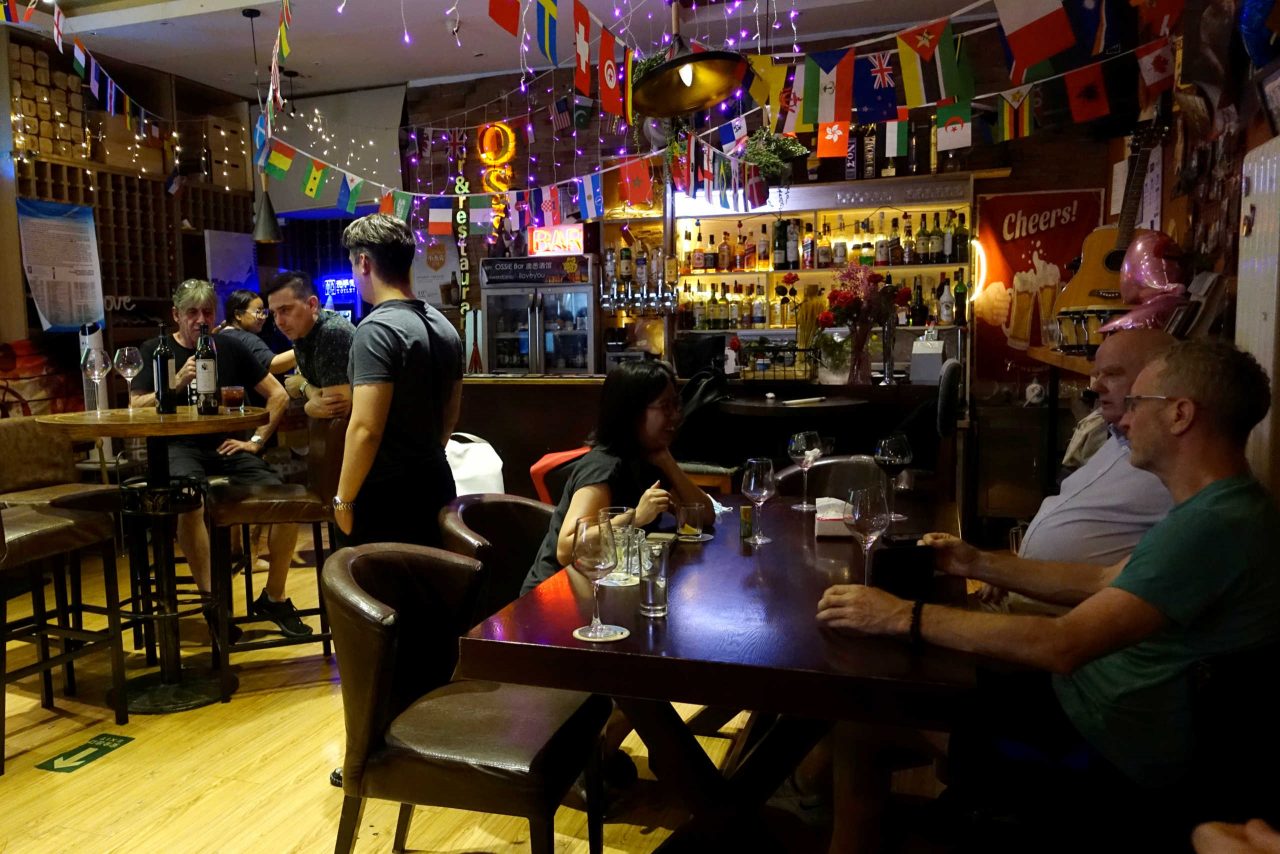 Customers are seen at the Ossie Bar and Restaurant in Beijing