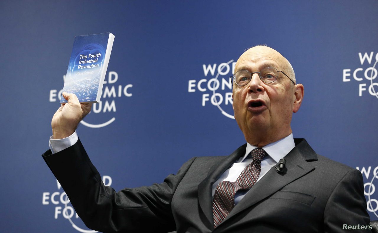 WEF Executive Chairman and founder Schwab presents his book, 'The Fourth Industrial Revolution', during a news conference in Cologny